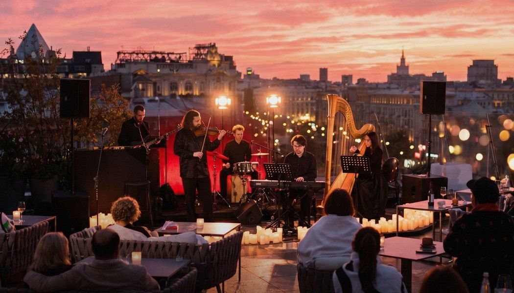 Ханс Циммер с камерным оркестром на арфе. Закат на крыше The Carlton